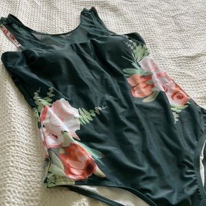 Dark green WI Beachwear swimsuit with mesh and open back.